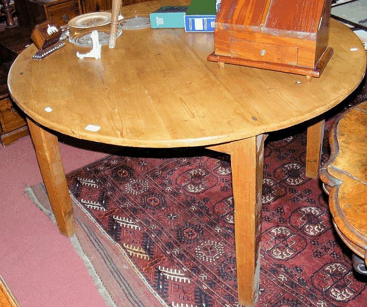 A rustic farmhouse style pine kitchen table
