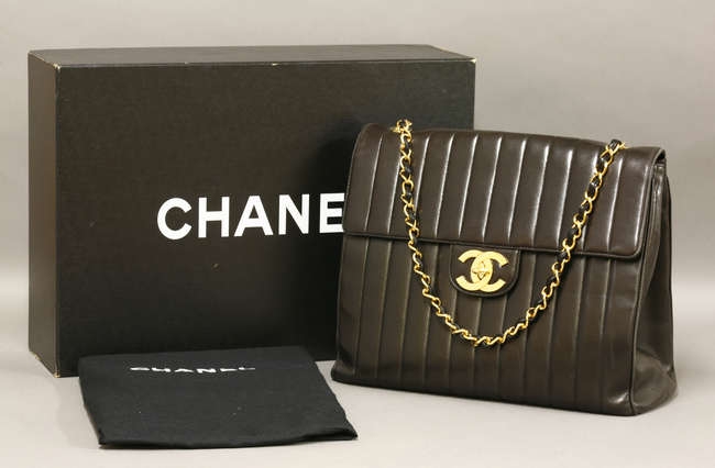 A Chanel black lambskin jumbo classic vintage 'Mademoiselle' flap bag, black lambskin with ...