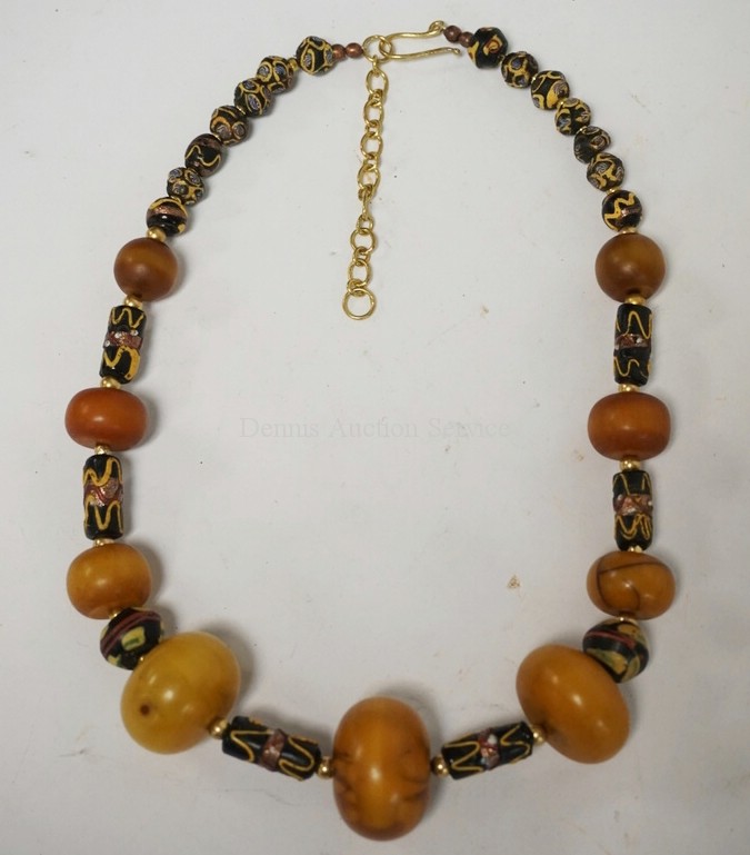 BEADED NECKLACE HAVING ANTIQUE AMBER BEADS AND FANCY TRADE BEADS.