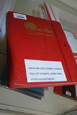 Stamp album stock book filled with various stamps