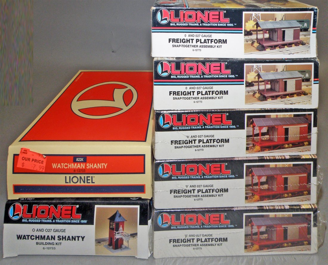 Seven boxed lionel buildings