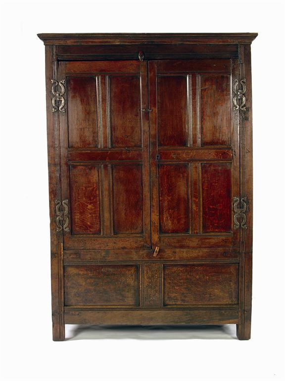 A panelled oak cupboard
