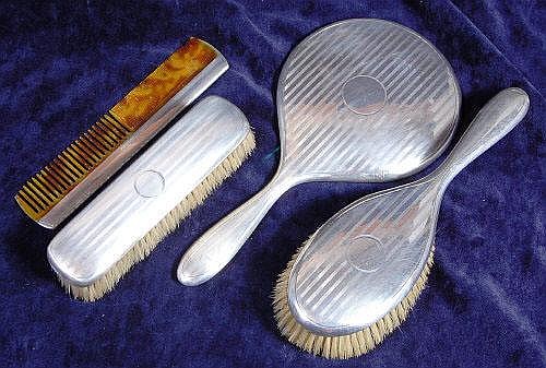 A Mappin & Webb silver four piece dressing table