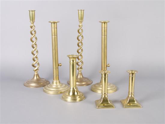Three Pairs of Brass Candlesticks, together with a single candlestick.
