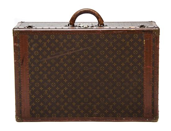 A Louis Vuitton Monogram Canvas Hard-sided Suitcase