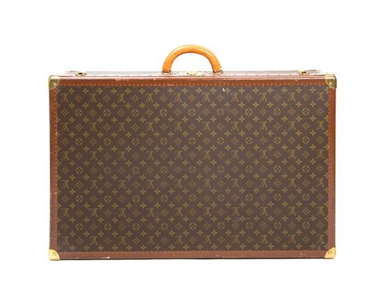 A Louis Vuitton Monogram Canvas Hard-sided Suitcase