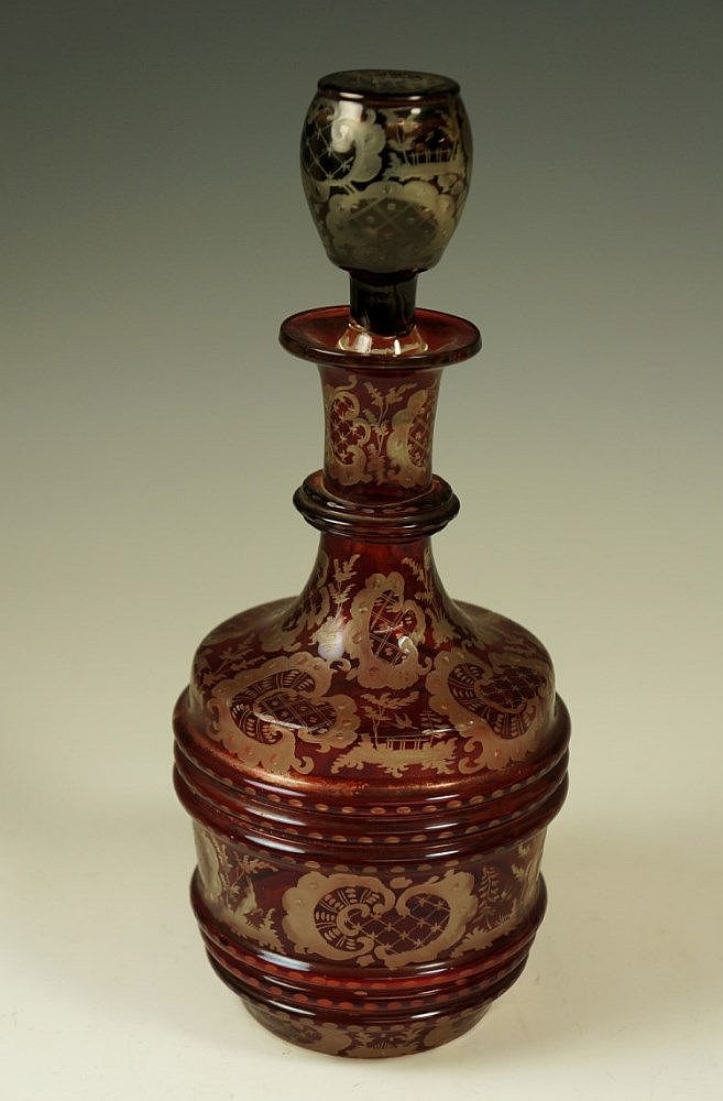 A Bohemian ruby flashed decanter and stopper the body and...