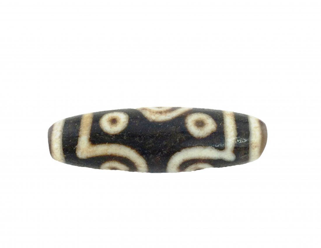 An eleven eyes tibetan agate dzi bead