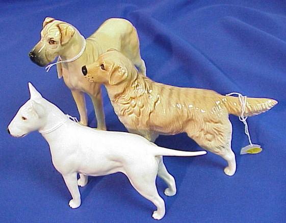 Three Beswick dog figurines including a golden retriever