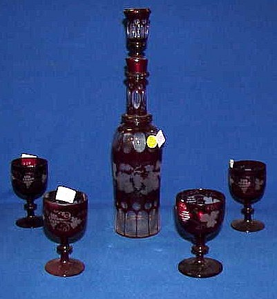 Bohemian ruby flashed cut to clear decanter and four wines.