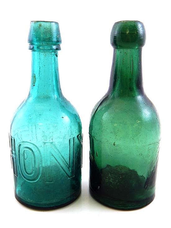 GLASS: Two bottles: "ANTHONY" soda bottle