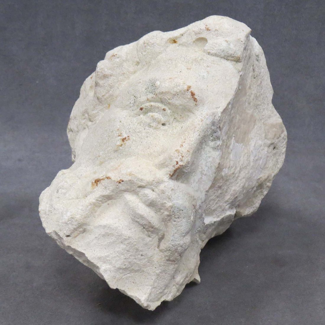 ROMAN CARVED LIMESTONE FRAGMENT HEAD OF A MAN