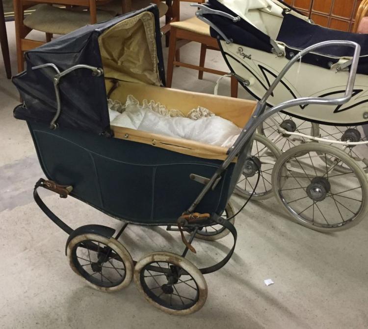 1920s Tri-ang dolls pram with green body.