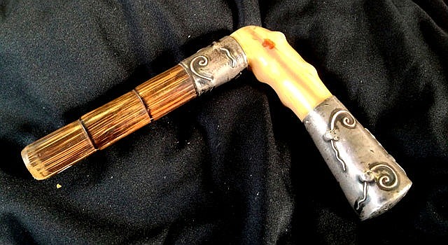 A Chinese Silver and Ivory Walking Stick Handle,