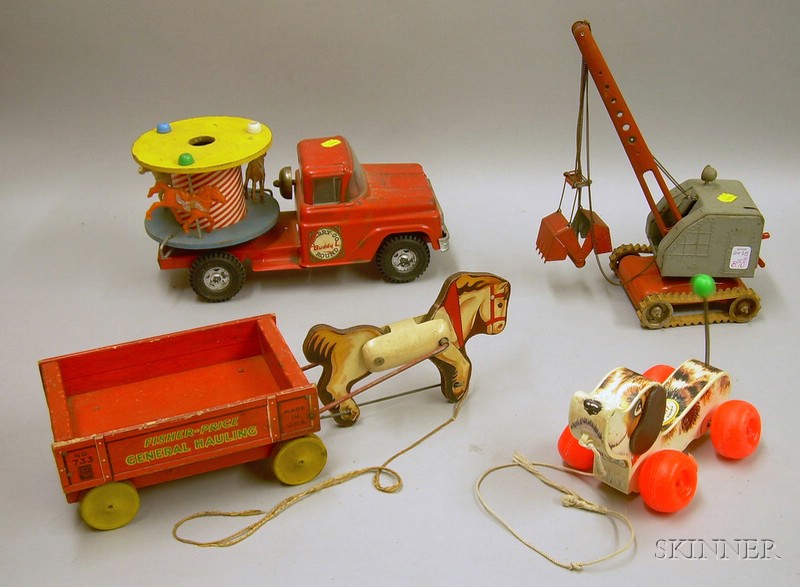 Buddy "L" Merry-Go-Round Truck, a German Digger, and Two Fisher-Price Toys