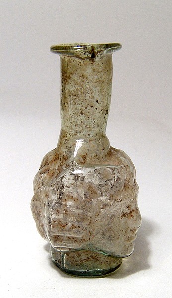 Roman pale yellow-green mold-blown janiform head flask