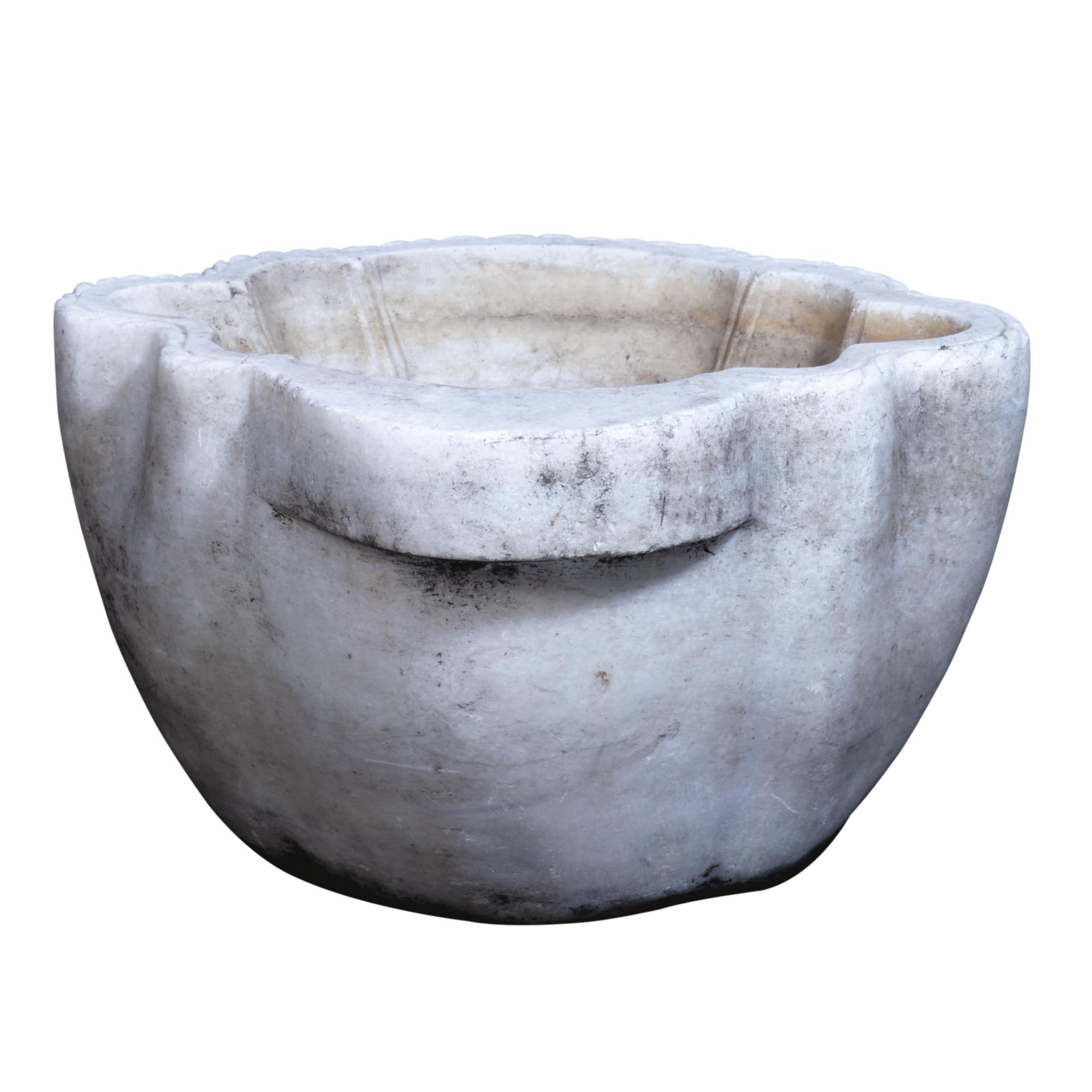 A variegated white marble basin