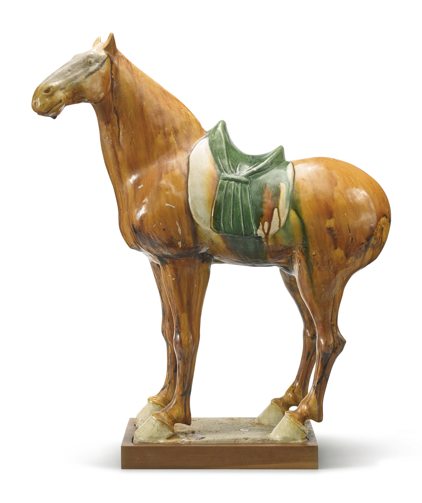 A sancai-glazed pottery figure of a horse tang dynasty
