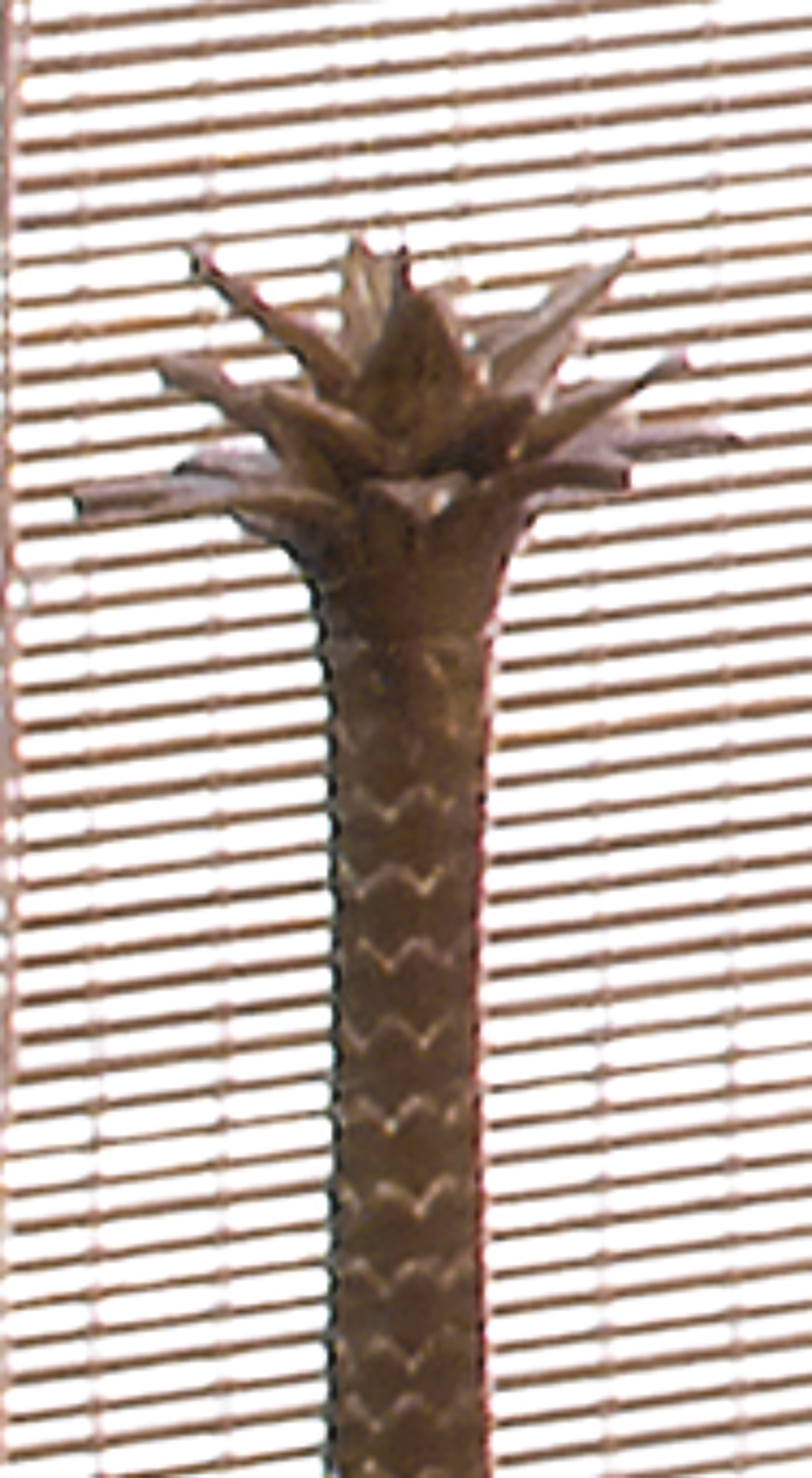A set of three palm tree-form pricket candlesticks by maitland-smith modern