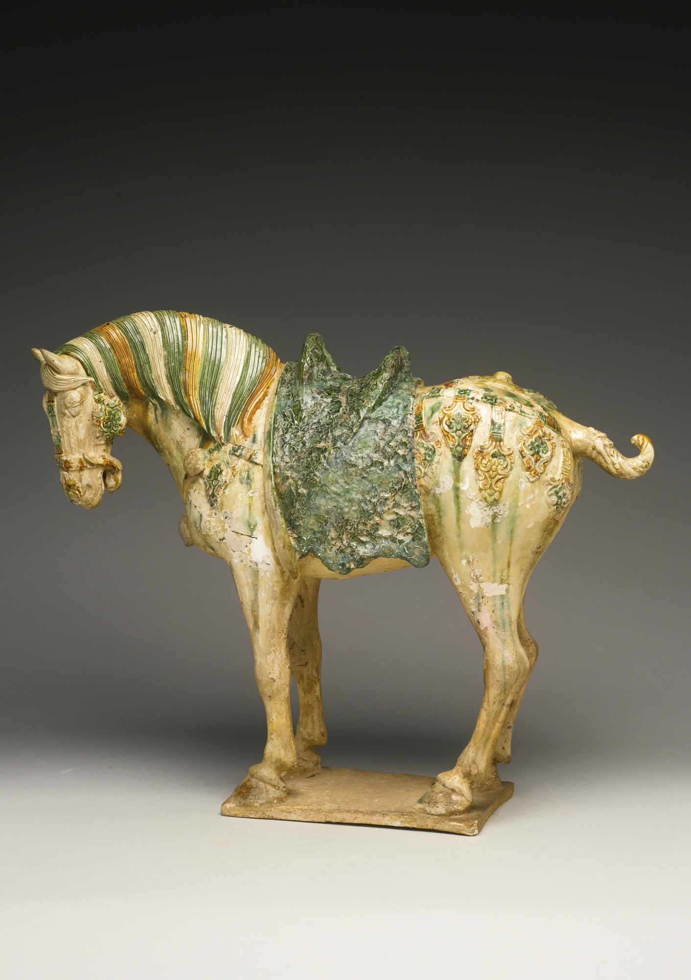 A sancai-glazed pottery figure of a caparisoned horse tang dynasty