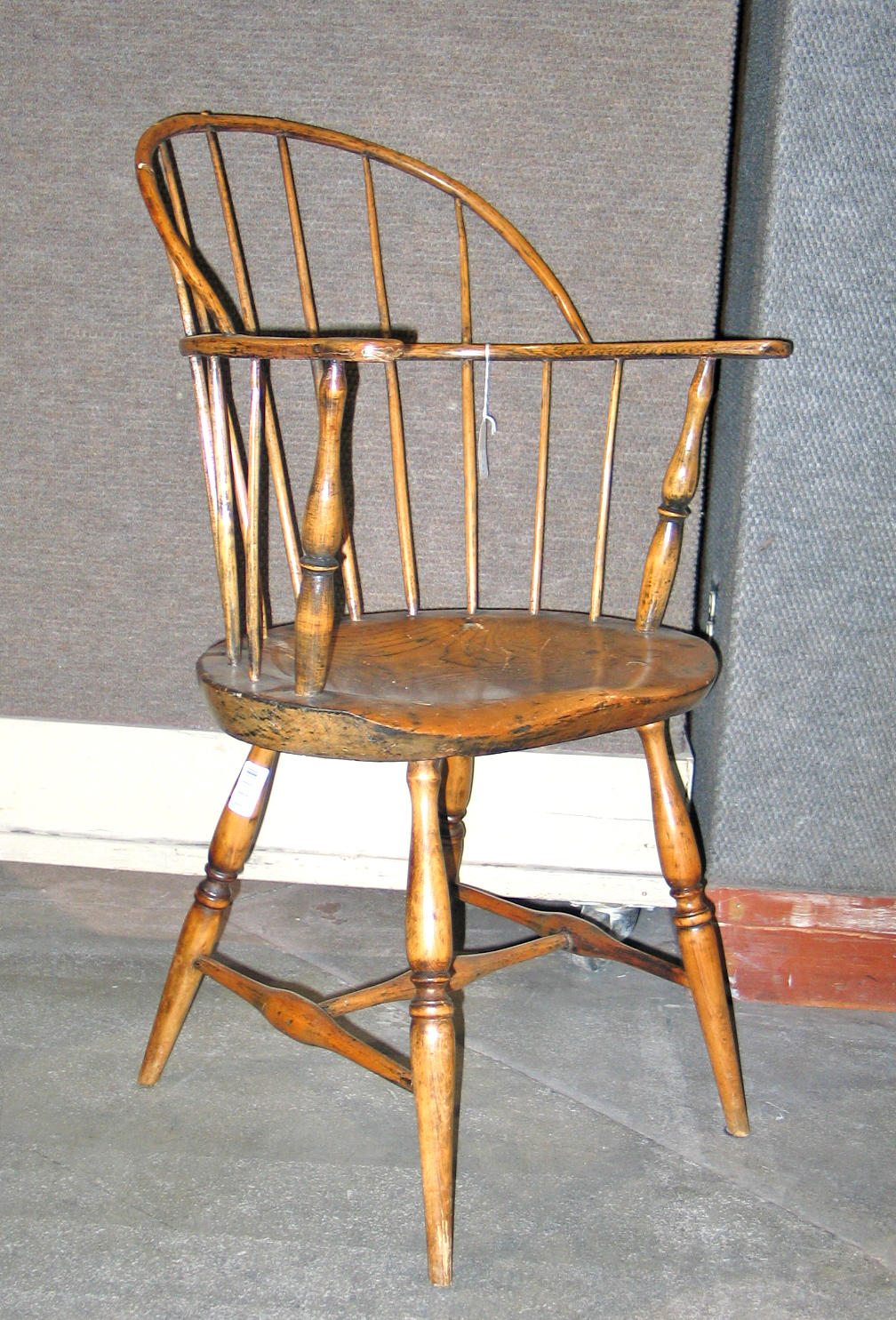 A mixed wood sack back Windsor chair