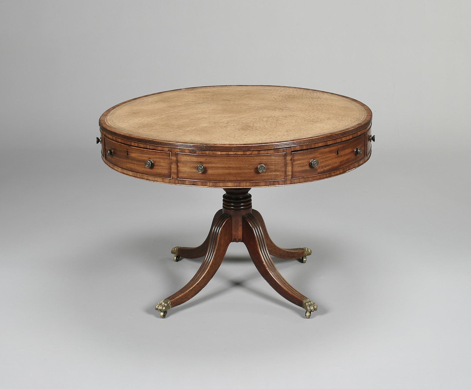 A Regency mahogany drum top library table