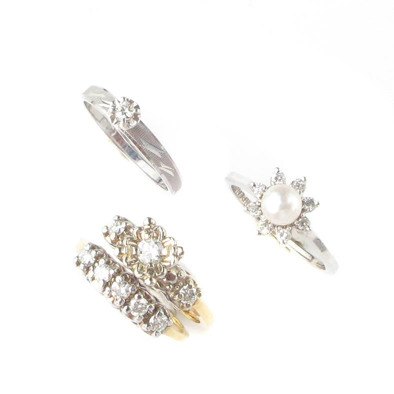 A collection of eight diamond, cultured pearl, yellow and white gold rings,
