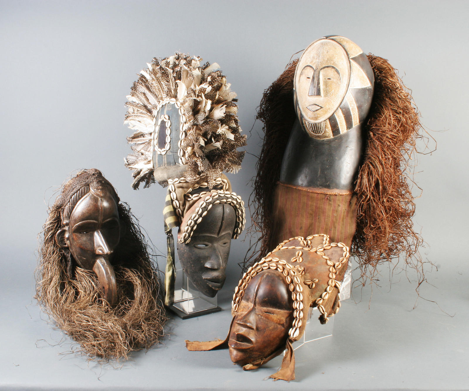 Four carved wooden tribal masks