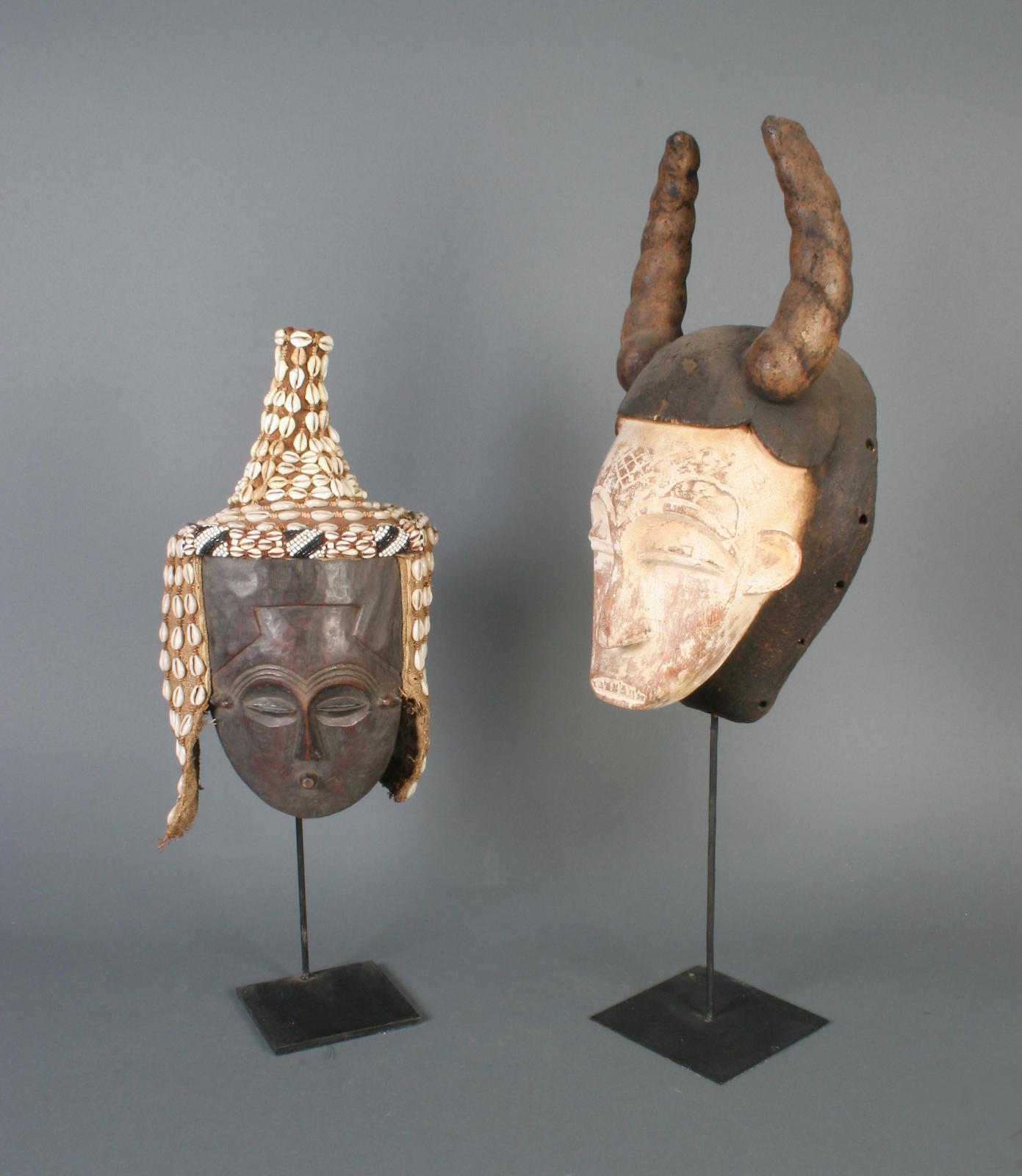 Two carved wooden tribal masks