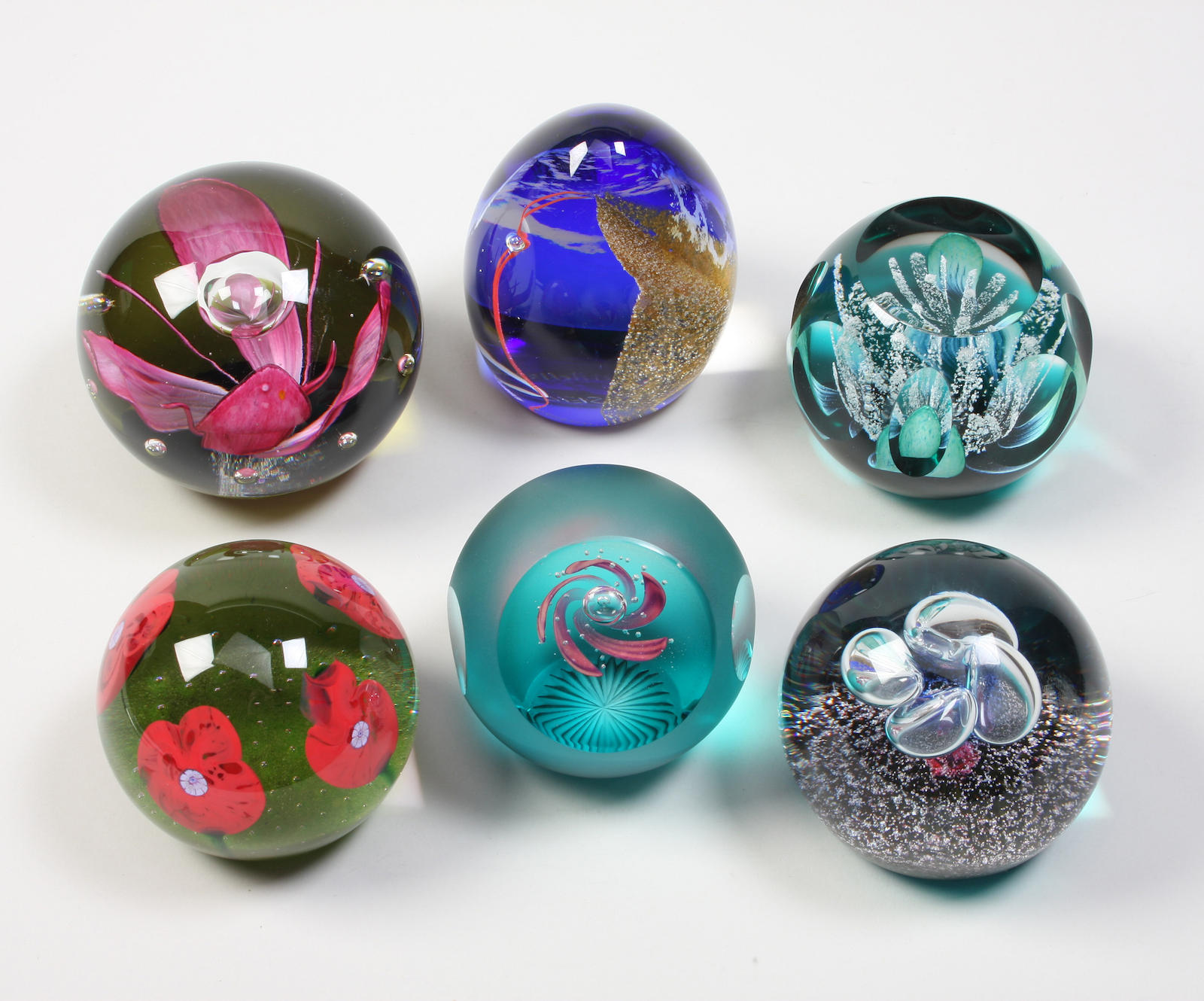 Six Caithness paperweights