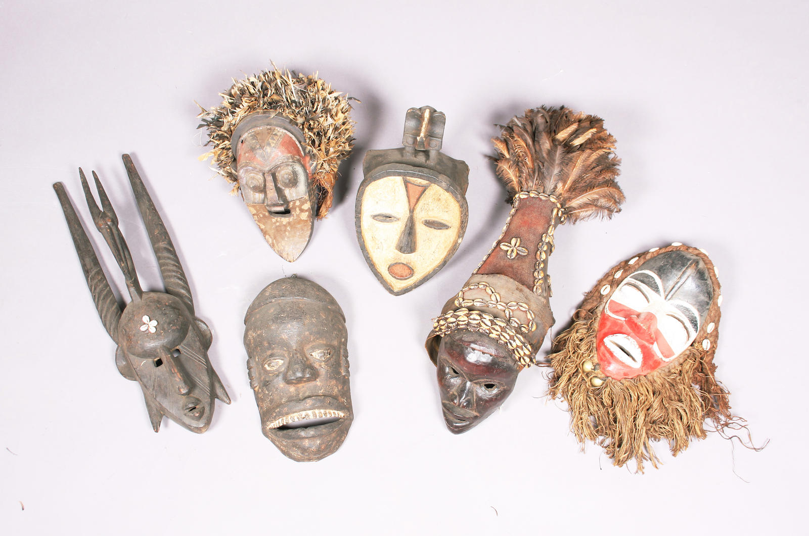 A group of six carved tribal masks