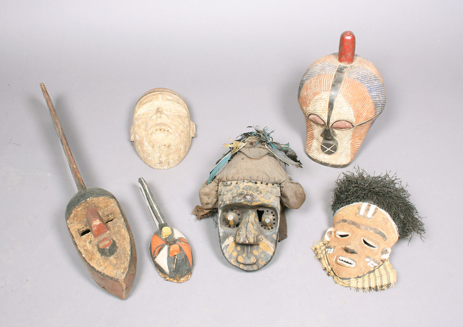A group of six carved wooden tribal masks
