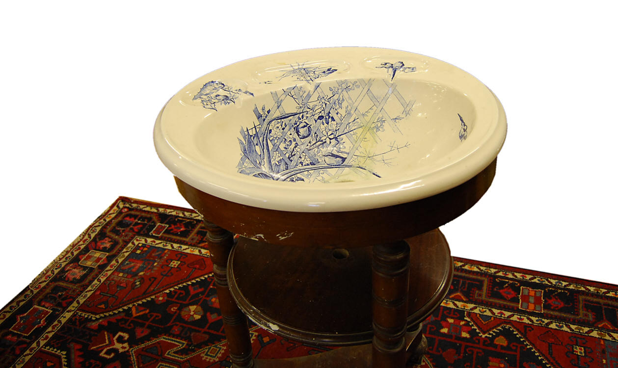 A circular mahogany washstand, 19th Century