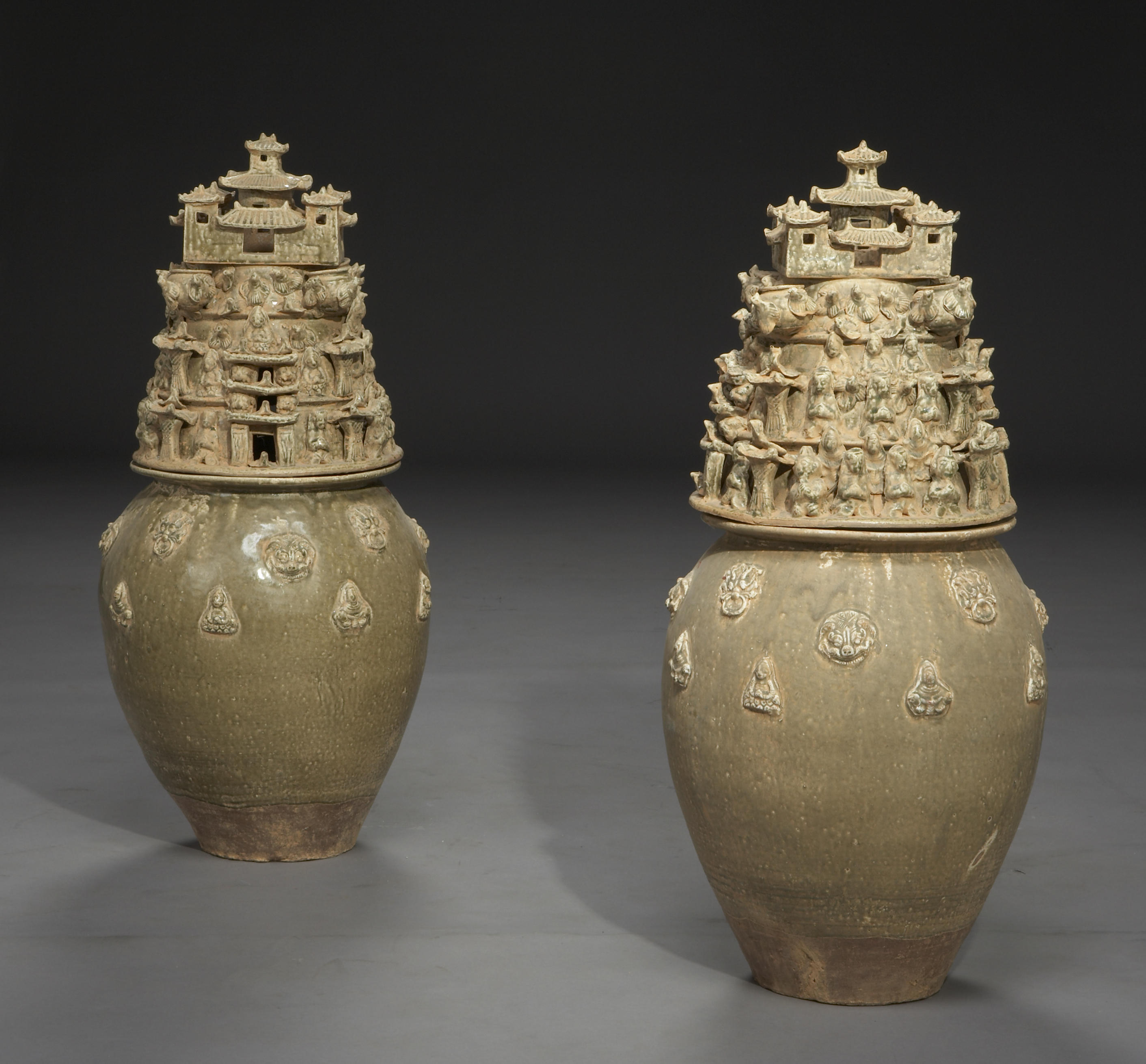 A pair of Chinese glazed earthenware covered vases