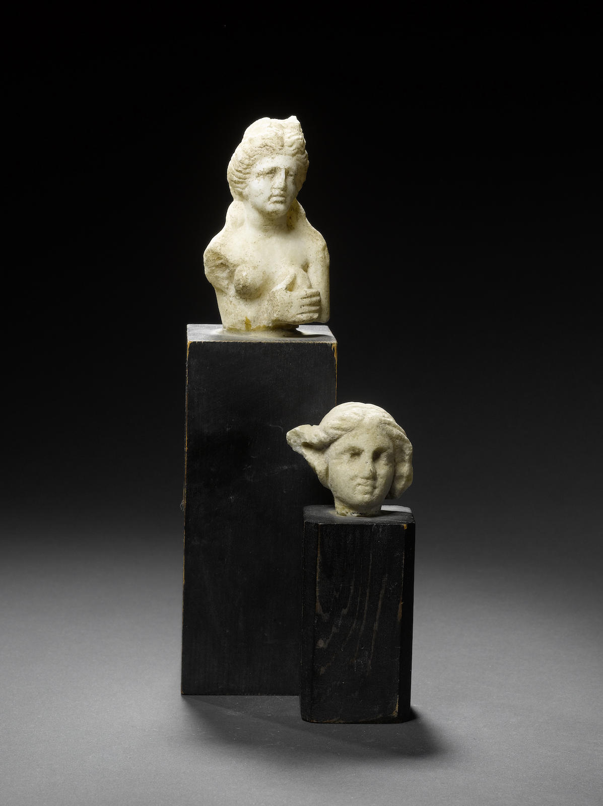 A Roman marble bust of Aphrodite and a Roman marble female head 2