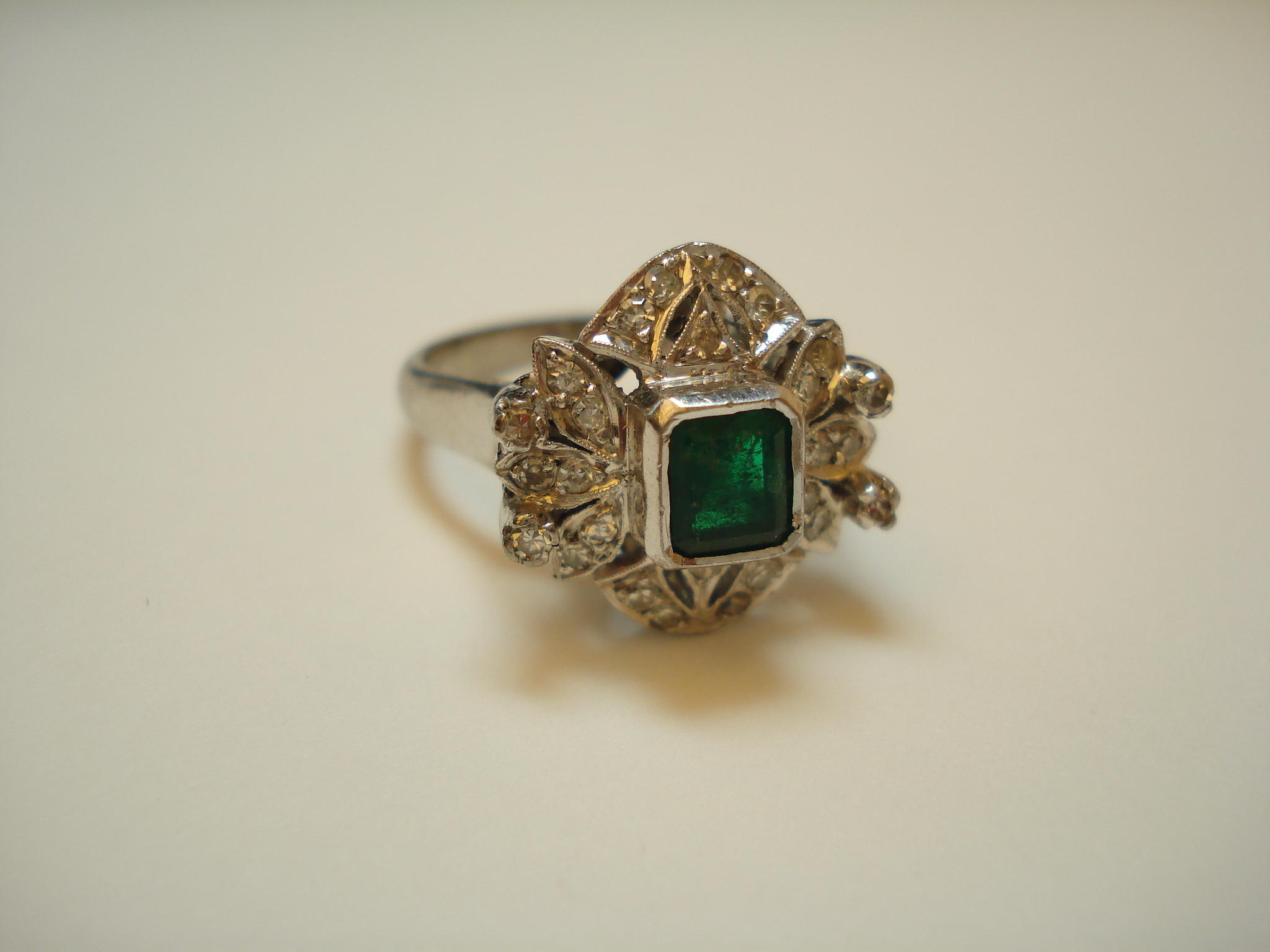 An emerald and diamond earring and ring suite