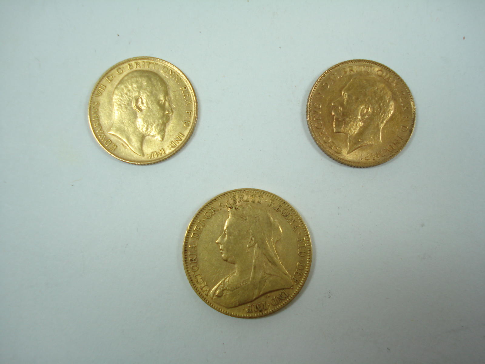 A sovereign and two half sovereigns