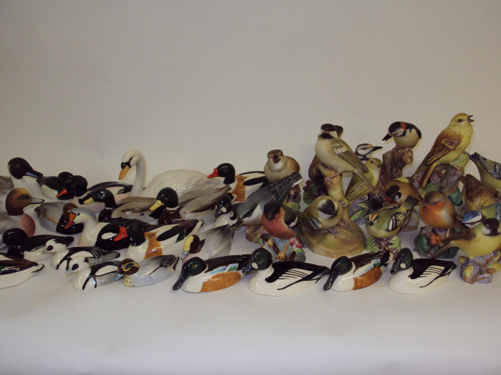 A collection of Beswick and Royal Worcester bird figurines