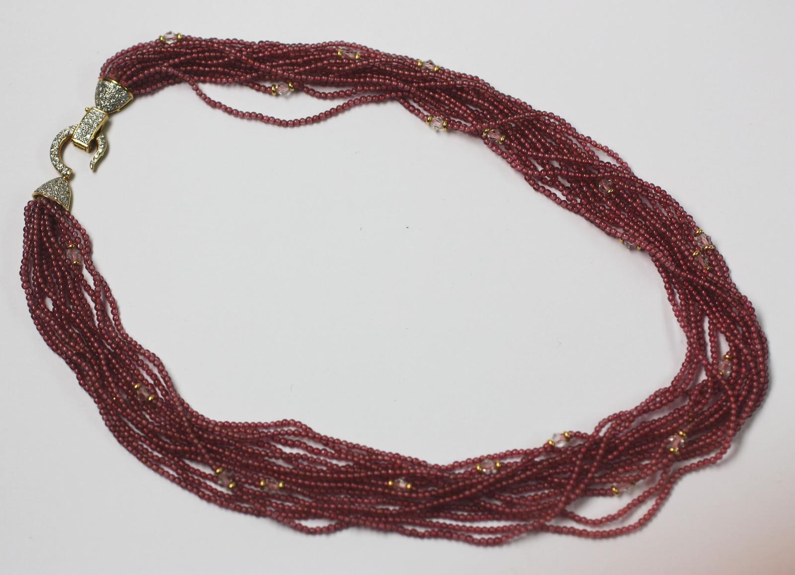 A muiti-strand garnet bead necklace,