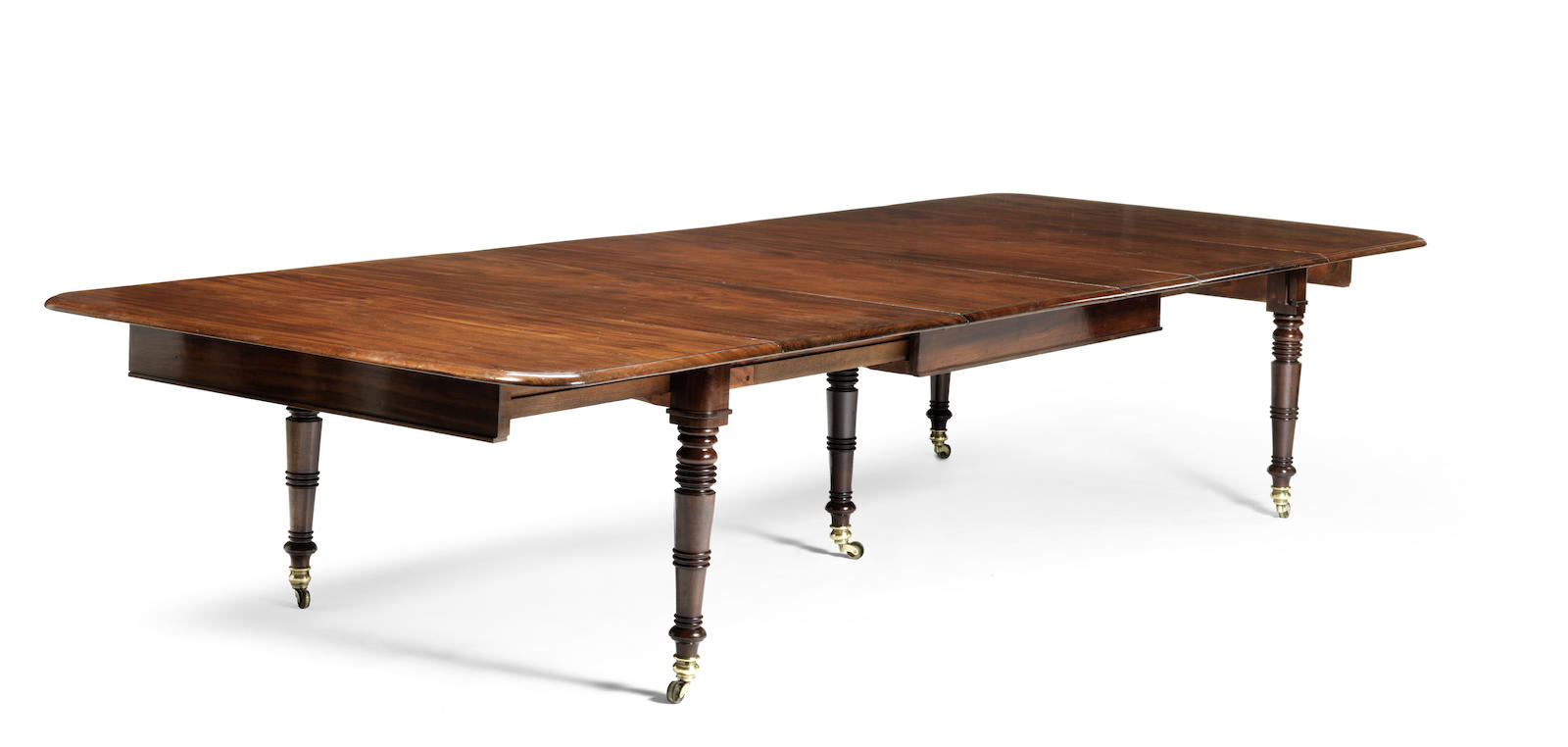 A Regency mahogany extending dining table