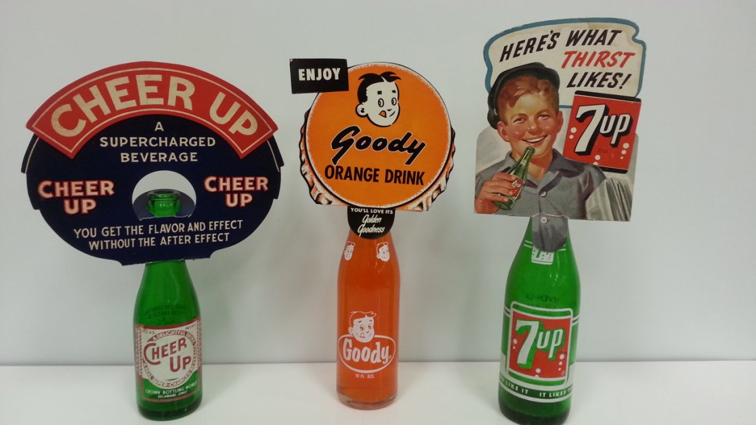 Soda pop bottle topper advertising signs & bottles