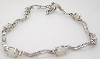 4504: 14KW 2.16ct Opal Oval Diamond Bracelet