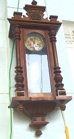 A late 19th Century walnut cased Viennese regulator style wall clock