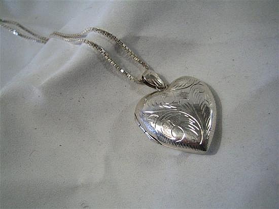 A SILVER LOCKET AND CHAIN