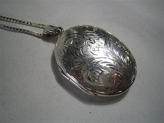 A SILVER LOCKET AND CHAIN