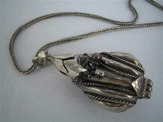 A SILVER LOCKET AND CHAIN