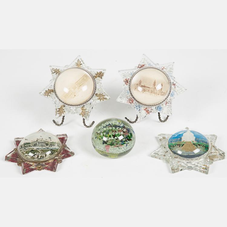 A Group of Five Glass Paperweights and Souvenirs by...