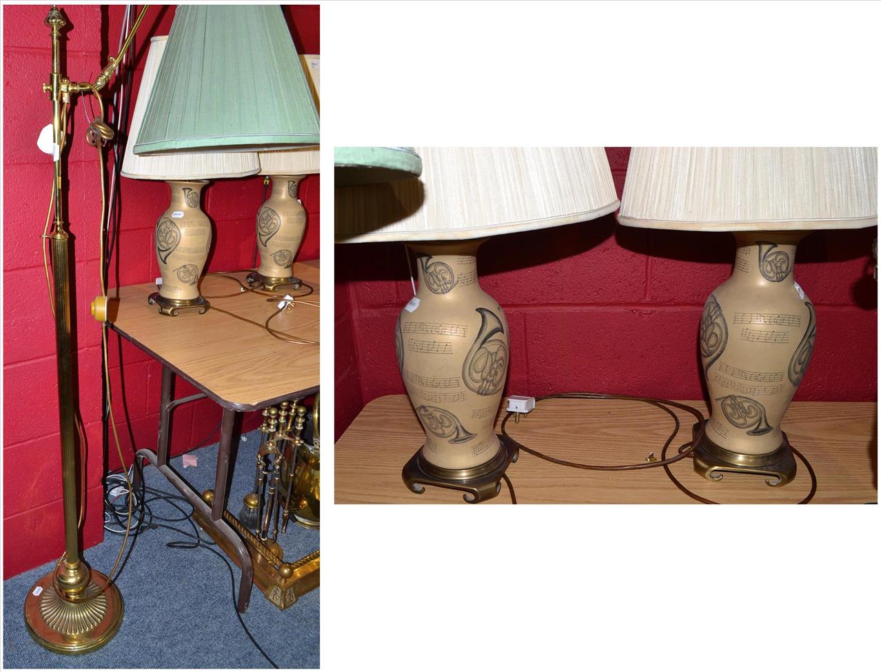 A reading lamp and a pair of table lamps