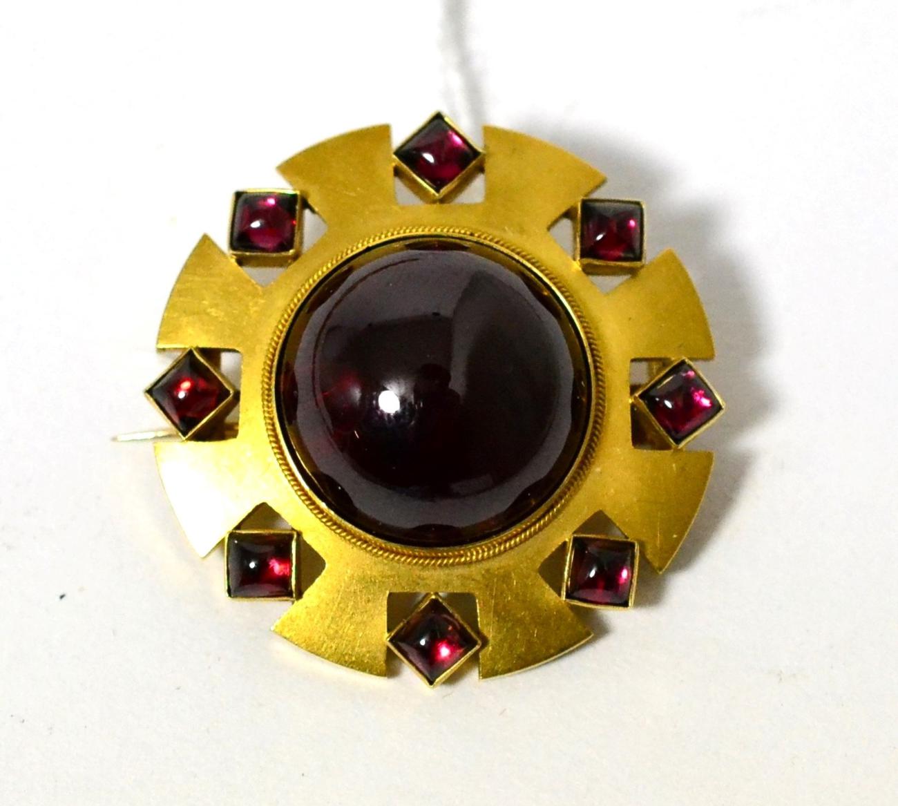 A Victorian foil backed carbuncle garnet target brooch