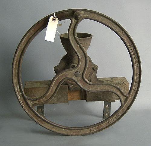 Iron grinder, stamped "Family Grist Mill,